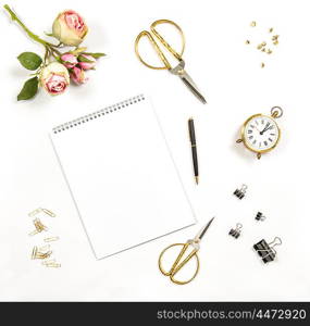 Artistic workplace. Paper, flowers, office tools and accessories. Flat lay, top view
