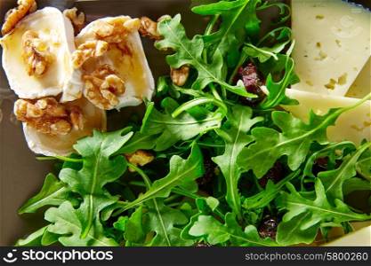 Arugula mediterranean salad with goat cheese honey and nuts