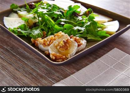 Arugula mediterranean salad with goat cheese honey and nuts
