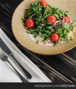 Arugula tomato salad with pine nuts