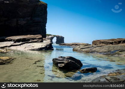 As Catedrais beach - Beach of the Cathedrals - in Galicia, Spain. Cliffs and ocean view. As Catedrais beach - Beach of the Cathedrals - Galicia, Spain