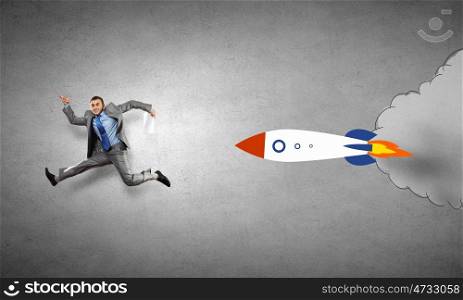 As fast as rocket. Young speedy businessman running in a hurry