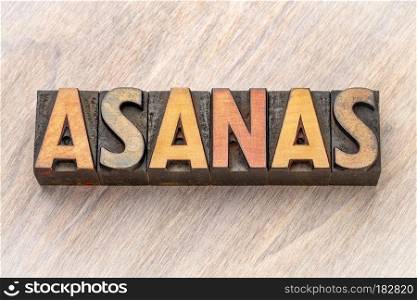 asanas - word abstract in wood type. asanas - word abstract in vintage letterpress wood type