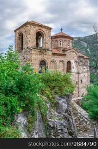Asenovgrad, Bulgaria 24.07.2019. Church of the holy mother of God in the Asens Fortress surrounded Bulgarian Rhodope mountains on a cloudy summer day. Medieval Asens Fortress in Bulgaria