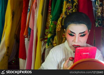 Asia / Thailand - August 28th 2019 : Chinese Opera Actress. Performers make up at backstage. . Asia / Thailand - August 28th, 2019 : Chinese Opera Actress. Performers make up backstage. Asian traditional cultural arts.