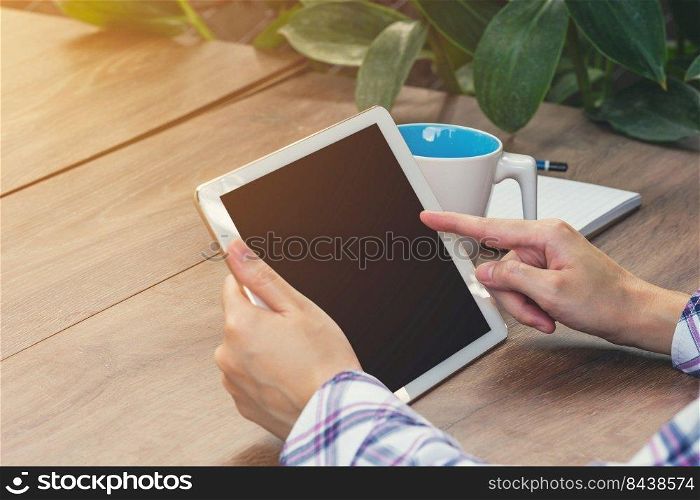 Asia woman using tablet on table in coffee shop