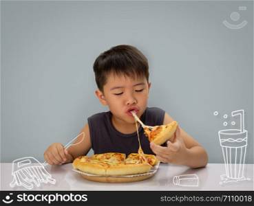 Asian 6-7 year boy is happy to eating pizza with a hot cheese melt stretched on blue background.
