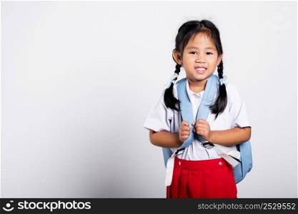 Asian adorable toddler smiling happy wearing student thai uniform red skirt standing in studio shot isolated on white background, Portrait little children girl preschool, Happy child Back to school