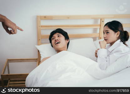 Asian adulterer and his unfaithful wife are indicated by marriage certificate husband. Paramour and divorce concept. Social problem theme. Asian people
