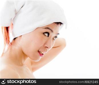 Asian American woman with towel wrapped on head