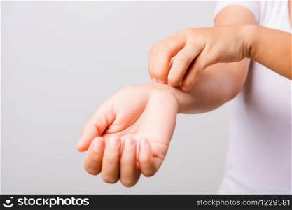 Asian beautiful woman itching her useing hand scratch itch hand on white background with copy space, Medical and Healthcare concept