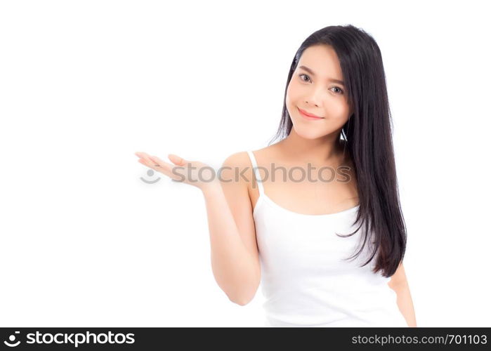 Asian beautiful young woman showing with healthy clean skin presenting something empty copy space on the hand isolated on white background, beauty concept.