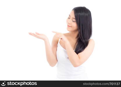 Asian beautiful young woman showing with healthy clean skin presenting something empty copy space on the hand isolated on white background, beauty concept.