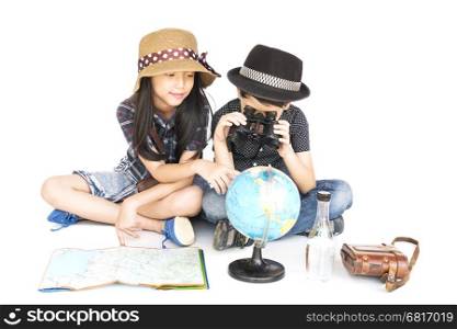 Asian boy and girl travelers are studying world map prepare to go, isolated over white background