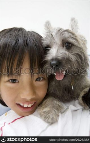 Asian boy and grey dog