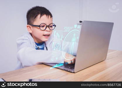 Asian boy doctor using a laptop computer