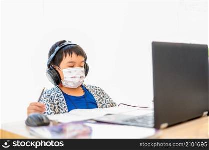 Asian boys tired of studying online ,using laptop computer studying online at home during home quarantine epidemic problem,homeschooling,online study,online learning,corona virus or technology concept