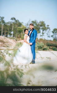 Asian bride and Caucasian groom have romance time and happy together 