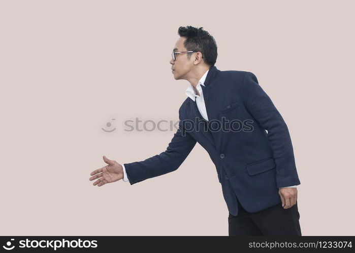 Asian Business man extending hand to shake