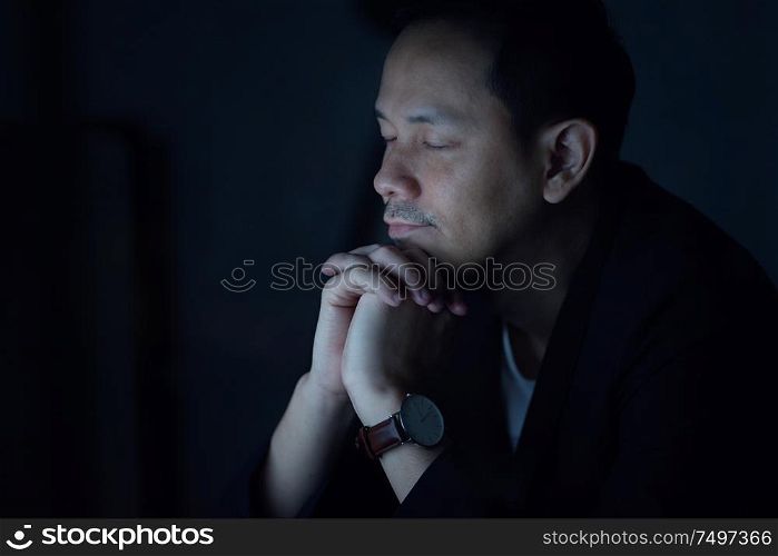 Asian business man praying