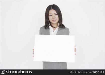 Asian business woman holding sign