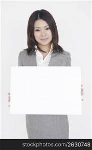 Asian business woman holding sign