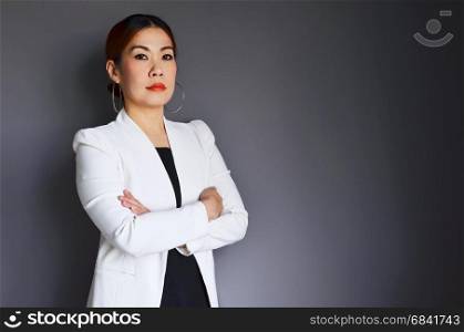 Asian business woman standing leader confident on gray background