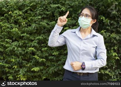 Asian business woman with healthy face mark protect corona virus. The 2019-20 coronavirus outbreak is an ongoing outbreak of coronavirus disease 2019 (COVID-19) has spread to the world.