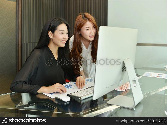 Asian Business women using computer in office