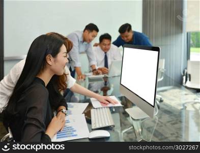 Asian Business women using laptop with blank screen in meeting room. Asian Business women using laptop with blank screen in meeting r