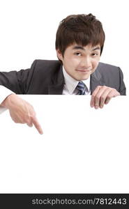 asian businessman pointing empty board