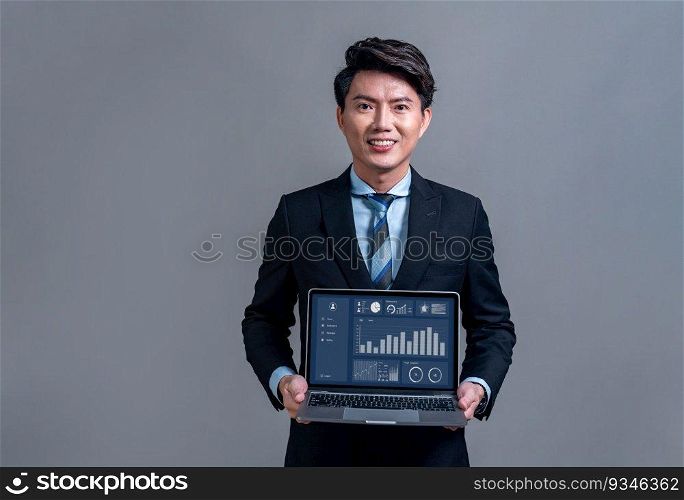 Asian businessman posing with laptop showing BI data analysis dashboard on screen. Analyst with laptop for job recruitment opportunity or software advertisement on isolated background. Jubilant. Businessman posing with laptop showing BI data analysis dashboard. Jubilant