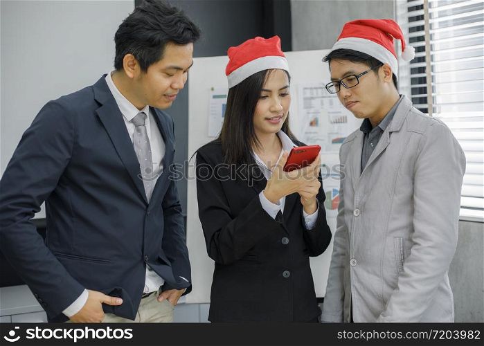 Asian businessmen and group using mobile phone for business partners discussing documents and ideas at meeting and business women smiling happy for working