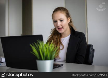 Asian businessmen and group using notebook for business partners discussing documents and ideas at meeting and business women smiling happy for working