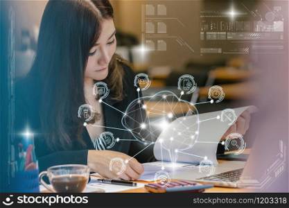 Asian businesswoman in formal suit working with computer laptop for Polygonal brain shape of an artificial intelligence with various icon of smart city Internet of Things, AI and business IOT concept