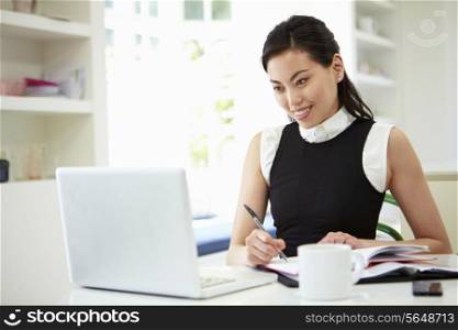 Asian Businesswoman Working From Home On Laptop