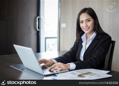 Asian businesswomen and group using notebook for business partners discussing documents and ideas at meeting and business women smiling happy for working