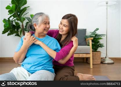 Asian careful caregiver or nurse taking care of the patient in a home.  Concept of happy retirement with care from a caregiver and Savings and senior health insurance, a Happy Family