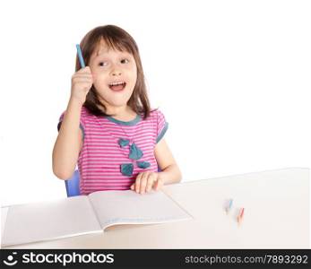 Asian caucasian girl doing homework at desk, back-to-school
