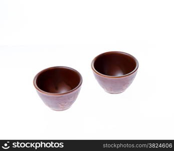 Asian ceramic cups for sake or soju on white background