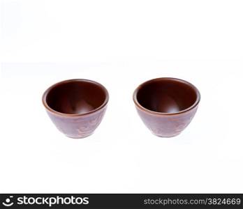 Asian ceramic cups for sake or soju on white background