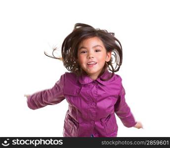Asian child girl jumping happy with winter purple coat moving hair on white