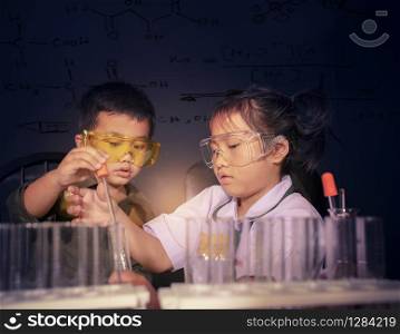 asian children in science examination laboratory