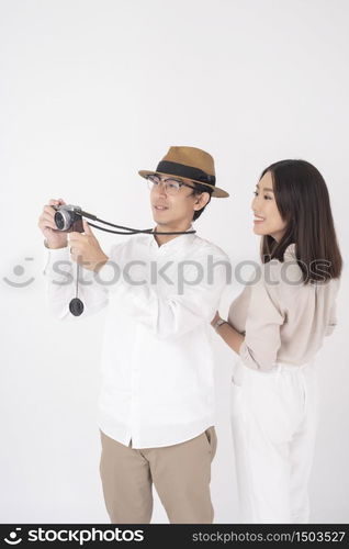 Asian couple tourists are enjoying on white background