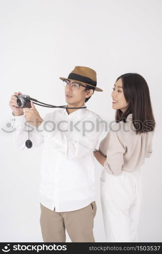 Asian couple tourists are enjoying on white background