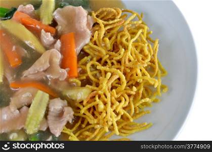 asian cuisine, crispy yellow noodle with in a creamy gravy sauce