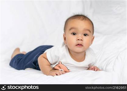 asian cute baby boy in bedroom with looking at camera