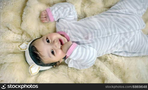 Asian cute baby girl . Asian cute baby girl lying on the bed