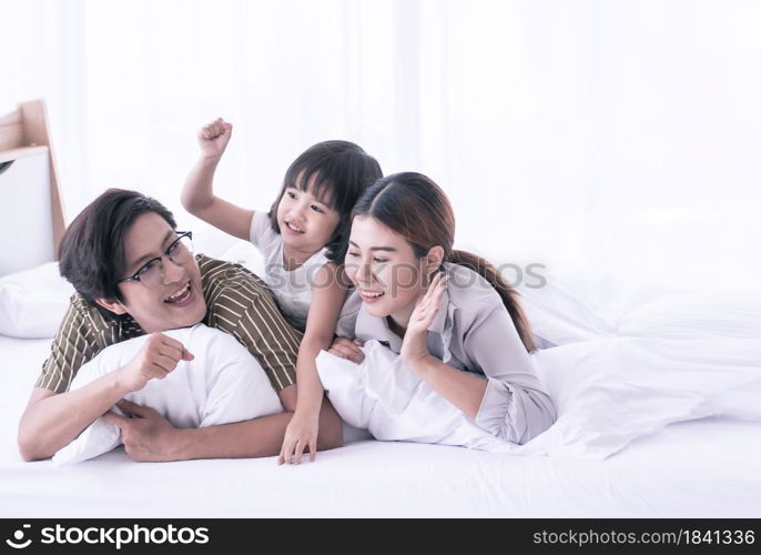 Asian cute family spending happy time on holidays and playing together at home