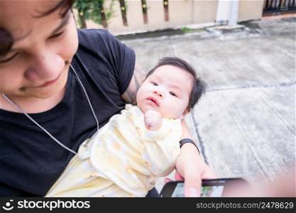 Asian dad father carry infant or baby child babe child childhood so cute in home family Pictures for newborns, mothers and children.